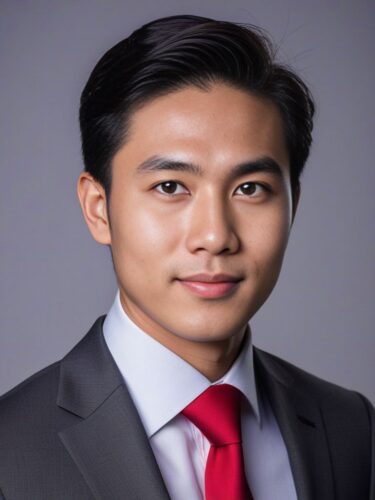 Headshot of a Young Southeast Asian Man in a Sharp Grey Suit and Red Tie