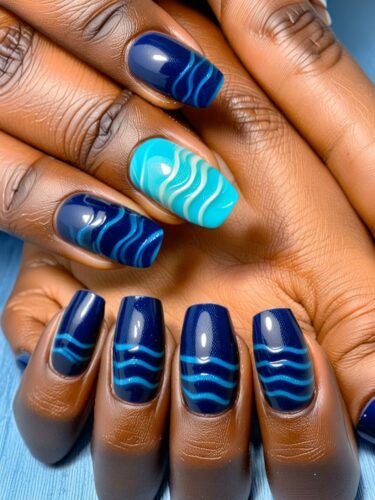 Deep Blue Waves and Sandy Accents Nail Art